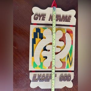 Wood Carving with Kente Fabric Decor